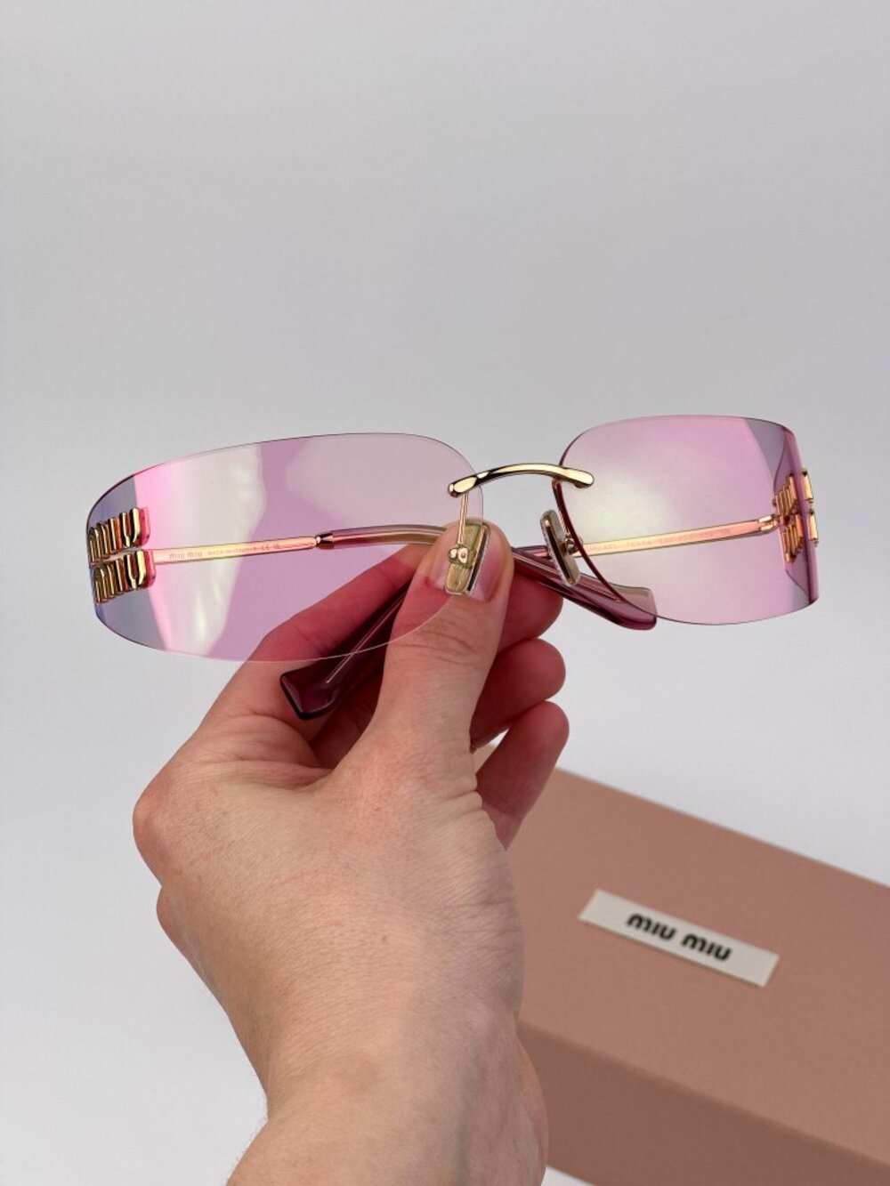 Miu Miu Women’s Sunglasses Gold Pink Rectangle Rimless Frames MUA51S 5AK90Y